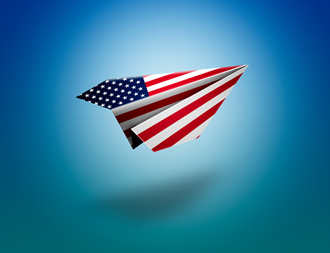 Flying paper plane origami with usa flag. clipping path for the plane
